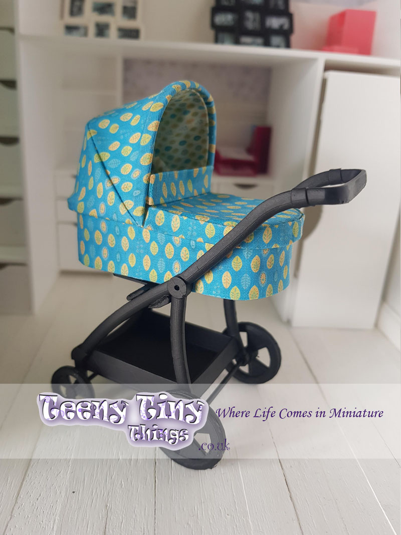 Modern Miniature Pram Fully Lined With Removable Apron And Built In Shopping Tray.